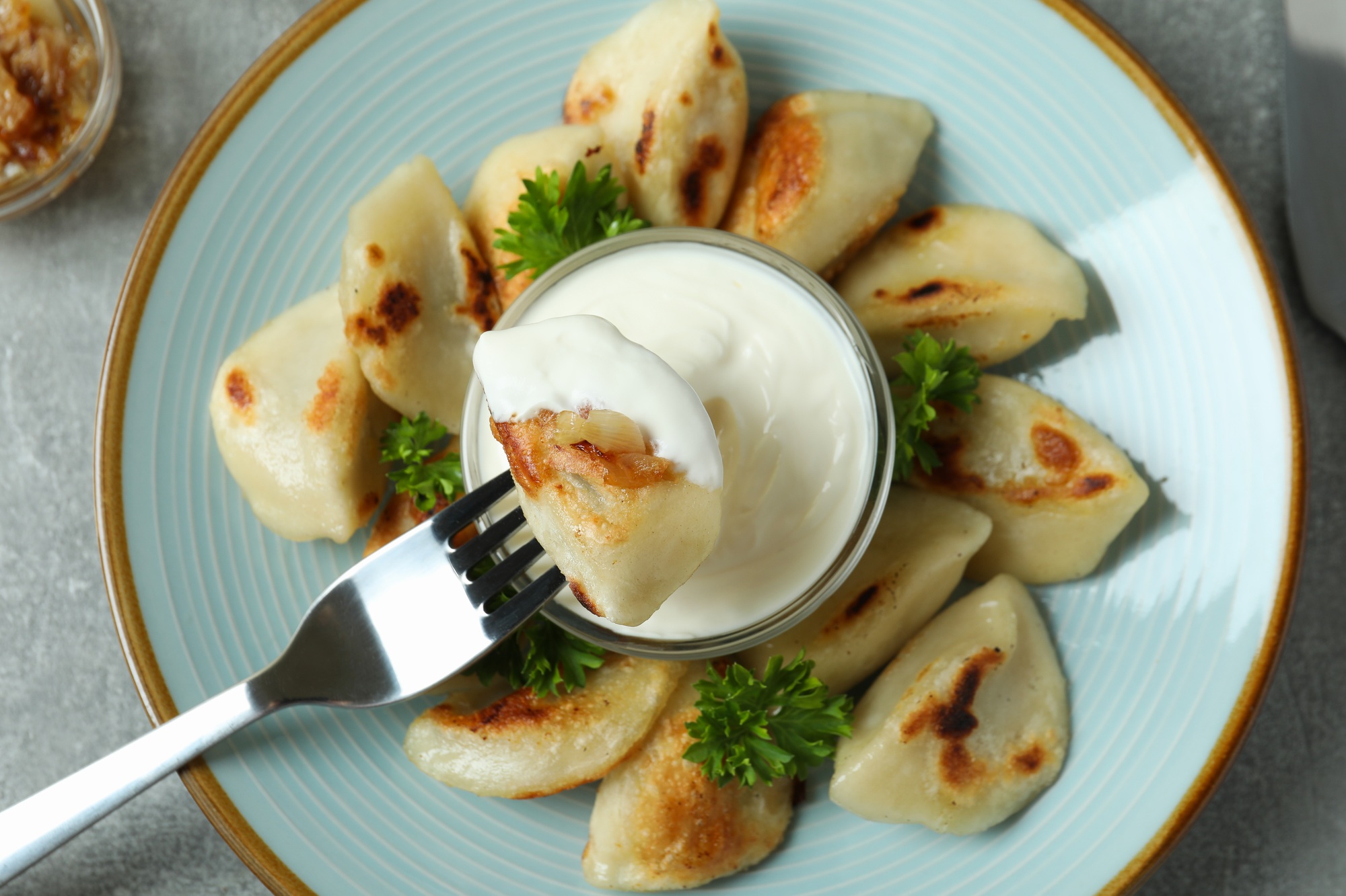 Concept of tasty food with vareniki or pierogi