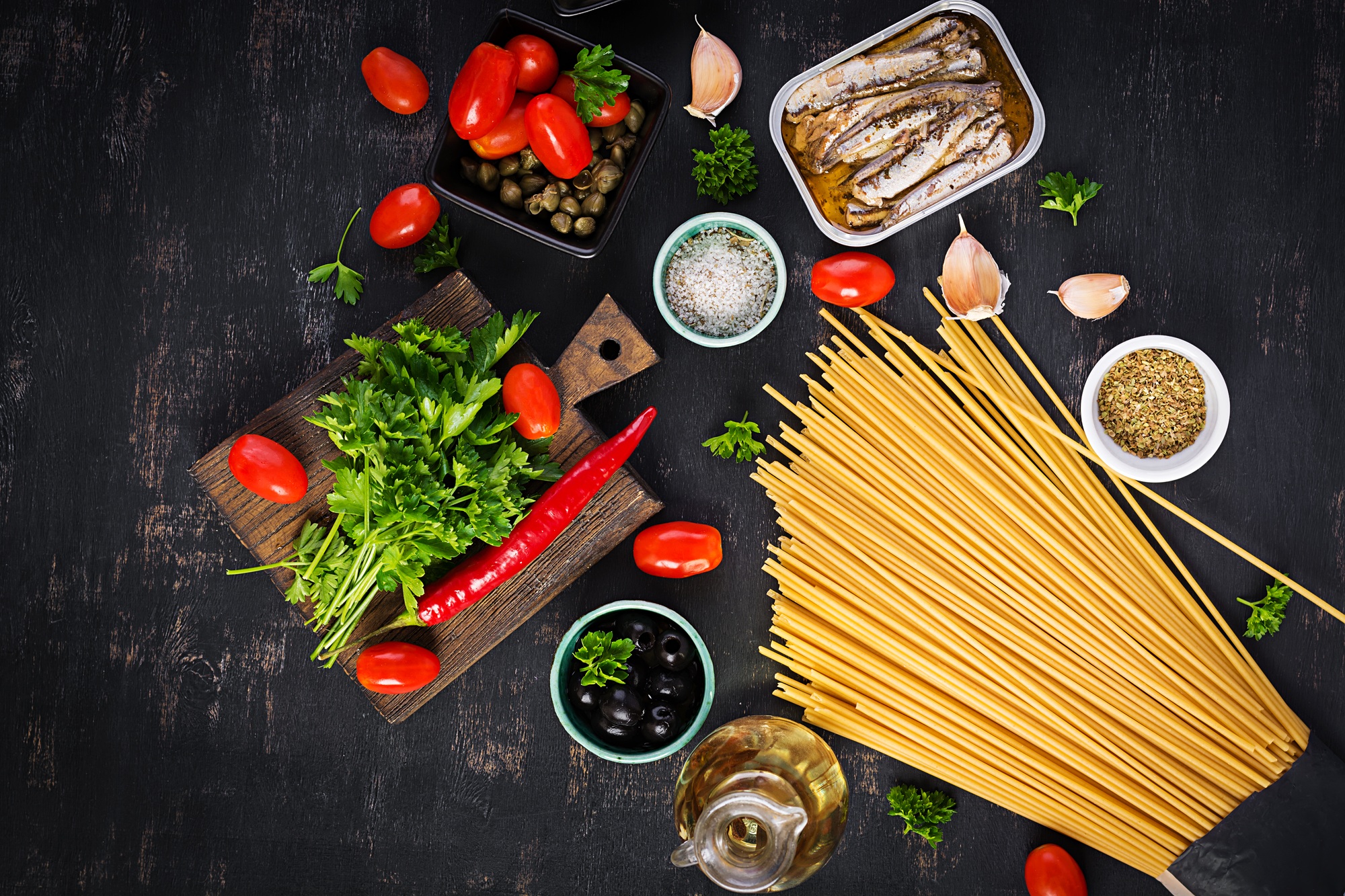 Ingredients for cooking pasta spaghetti alla puttanesca