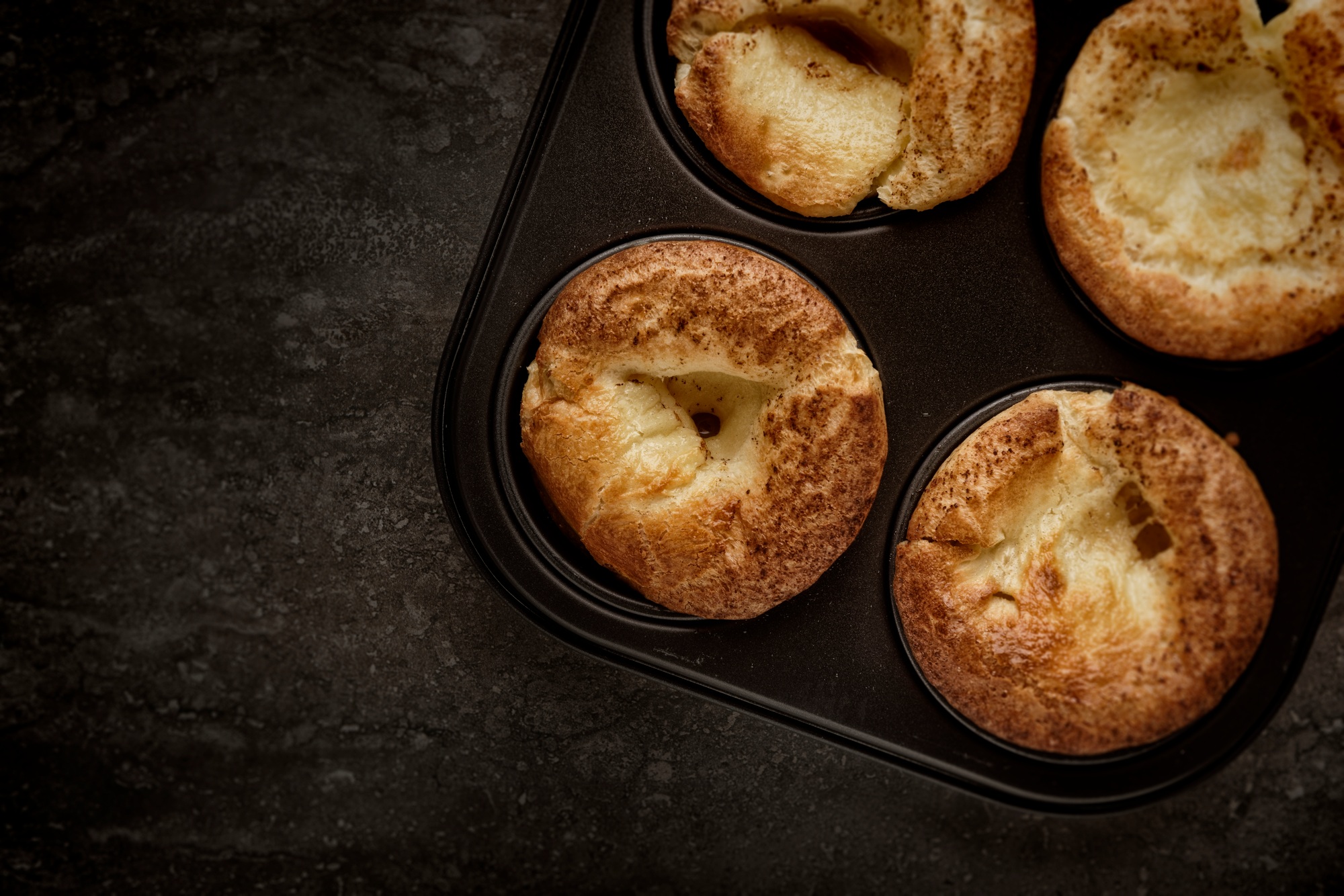 Top view of a pan filled with freshly baked Yorkshire Puddings